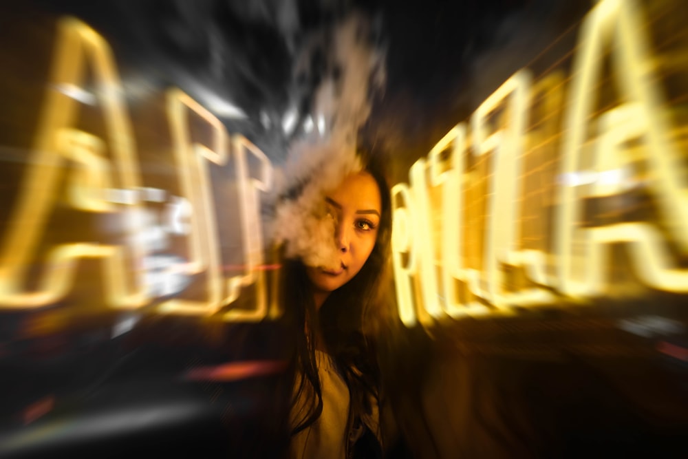 woman near yellow neon sign