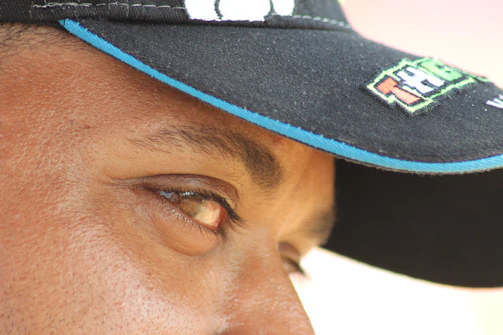 Close-up of a vibrant custom cap with intricate embroidery and bright colors.