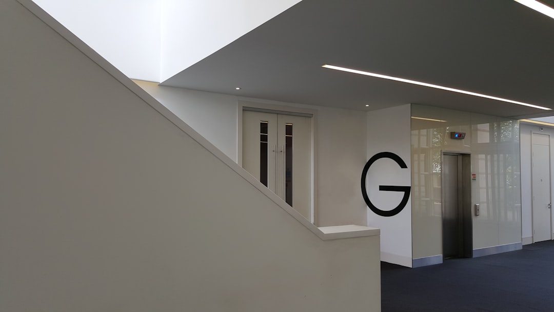 white concrete building, The architectural lines of a business building ground floor