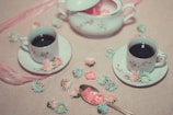 filled white ceramic cups and saucers
