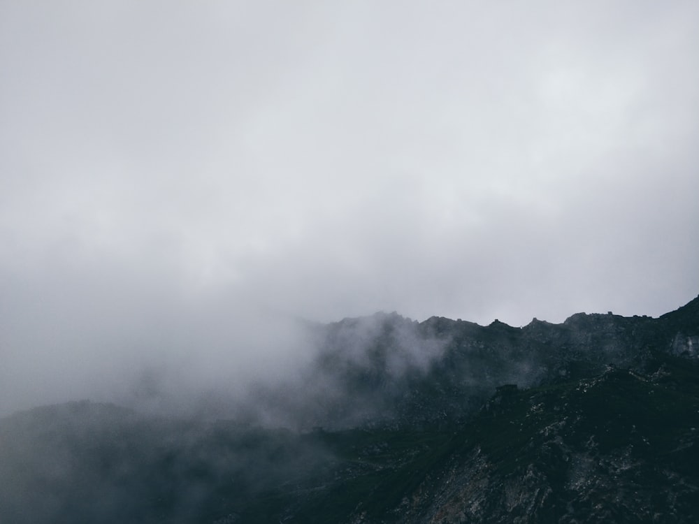 mountain under cloudy sky