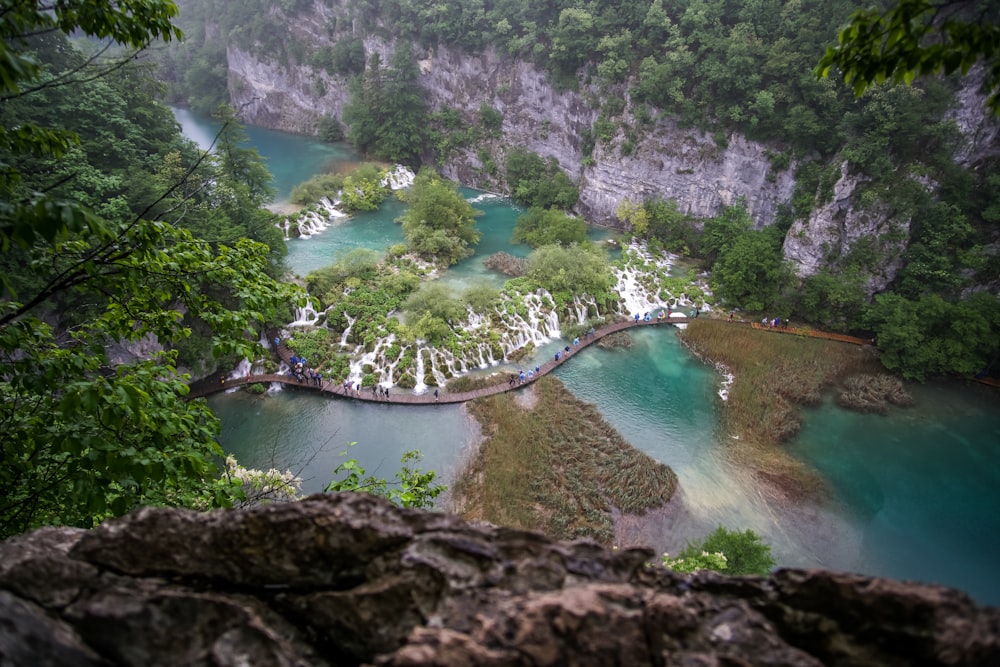 aerial photography of body of water between mountains