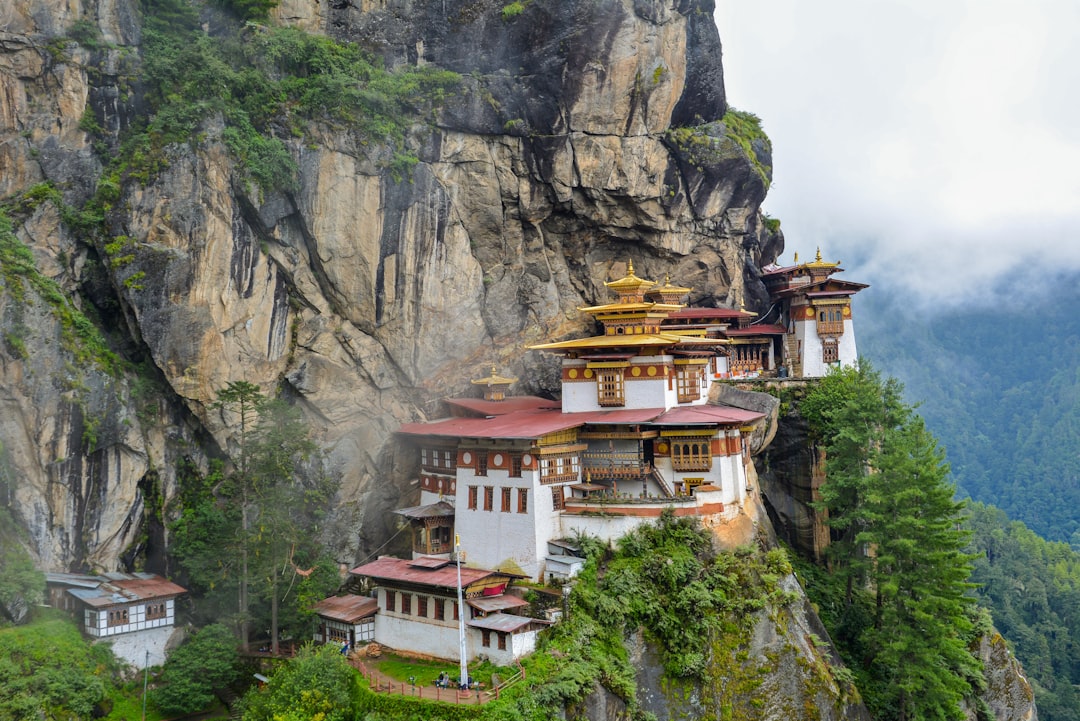 Another shot of the breathtaking scenery of Taktsang Monastery (1692) and Bhutan mountainous landscape. It was still early morning when a few friends and I got there. The clouds/mist are still low and sometimes block the view of the temple. 

Read more about it here: https://en.wikipedia.org/wiki/Paro_Taktsang