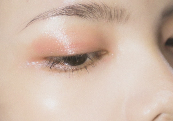 a close up of a woman's eye with makeup