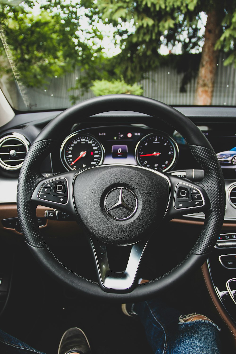 black Mercedes-Benz steering wheel