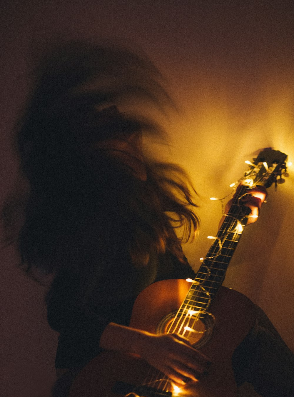 woman playing guitar