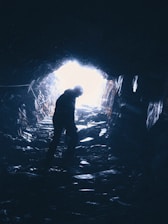 person standing in cave