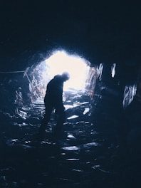 person standing in cave