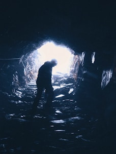 person standing in cave