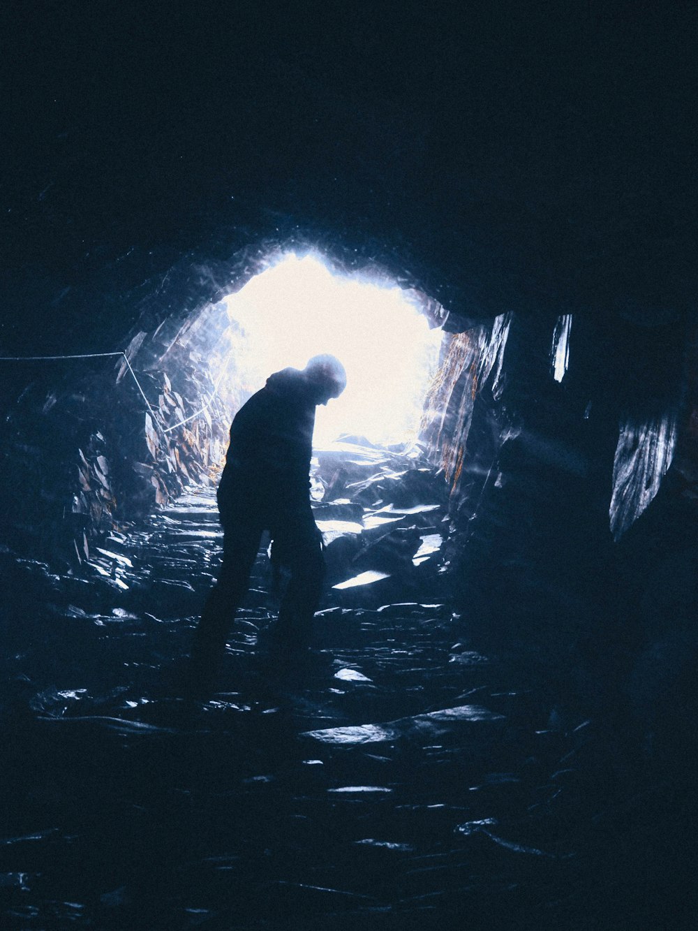 person standing in cave