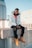 man sitting on concrete block