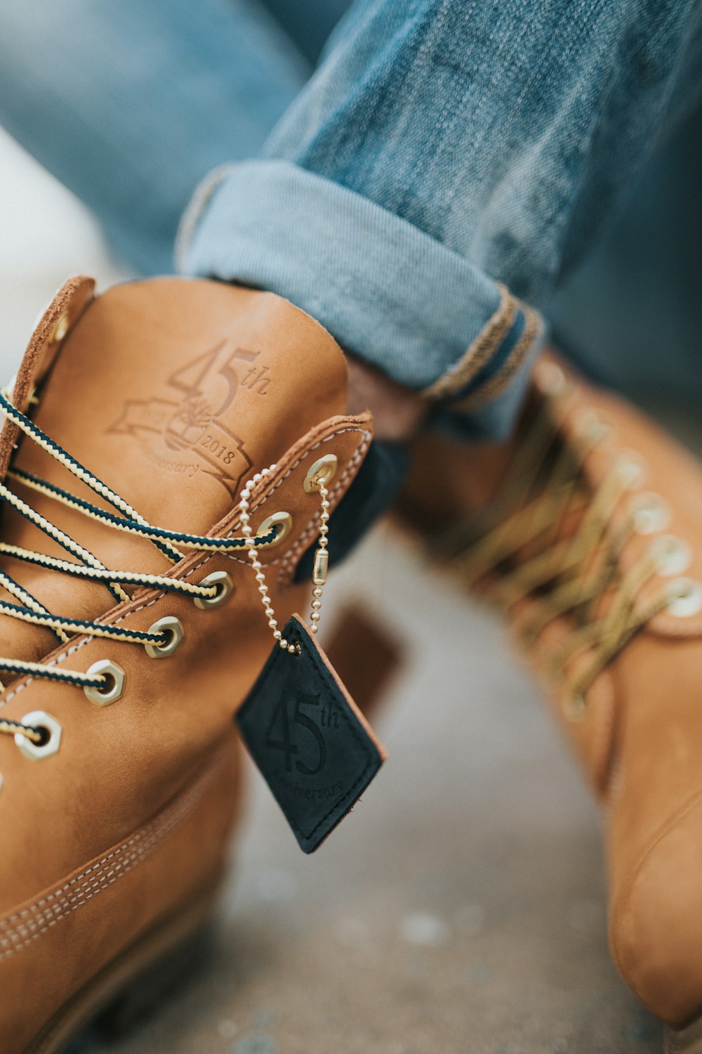 person wearing brown leather work boots