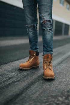 man wearing brown work boots