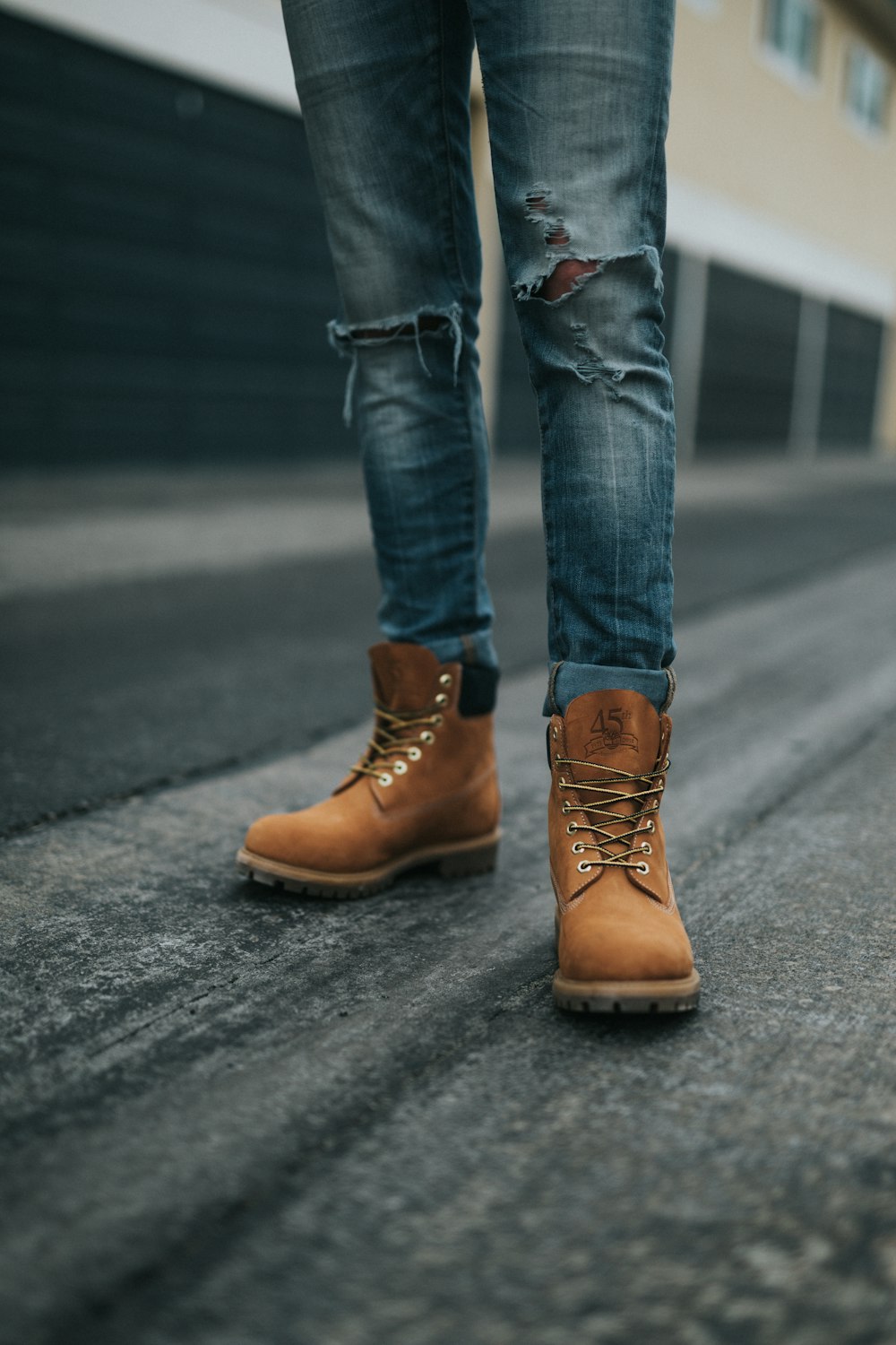 man wearing brown work boots
