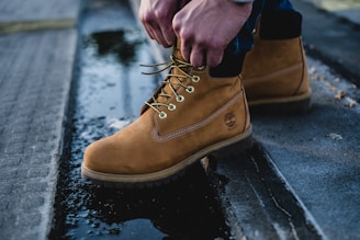 man in brown Timberland work boots