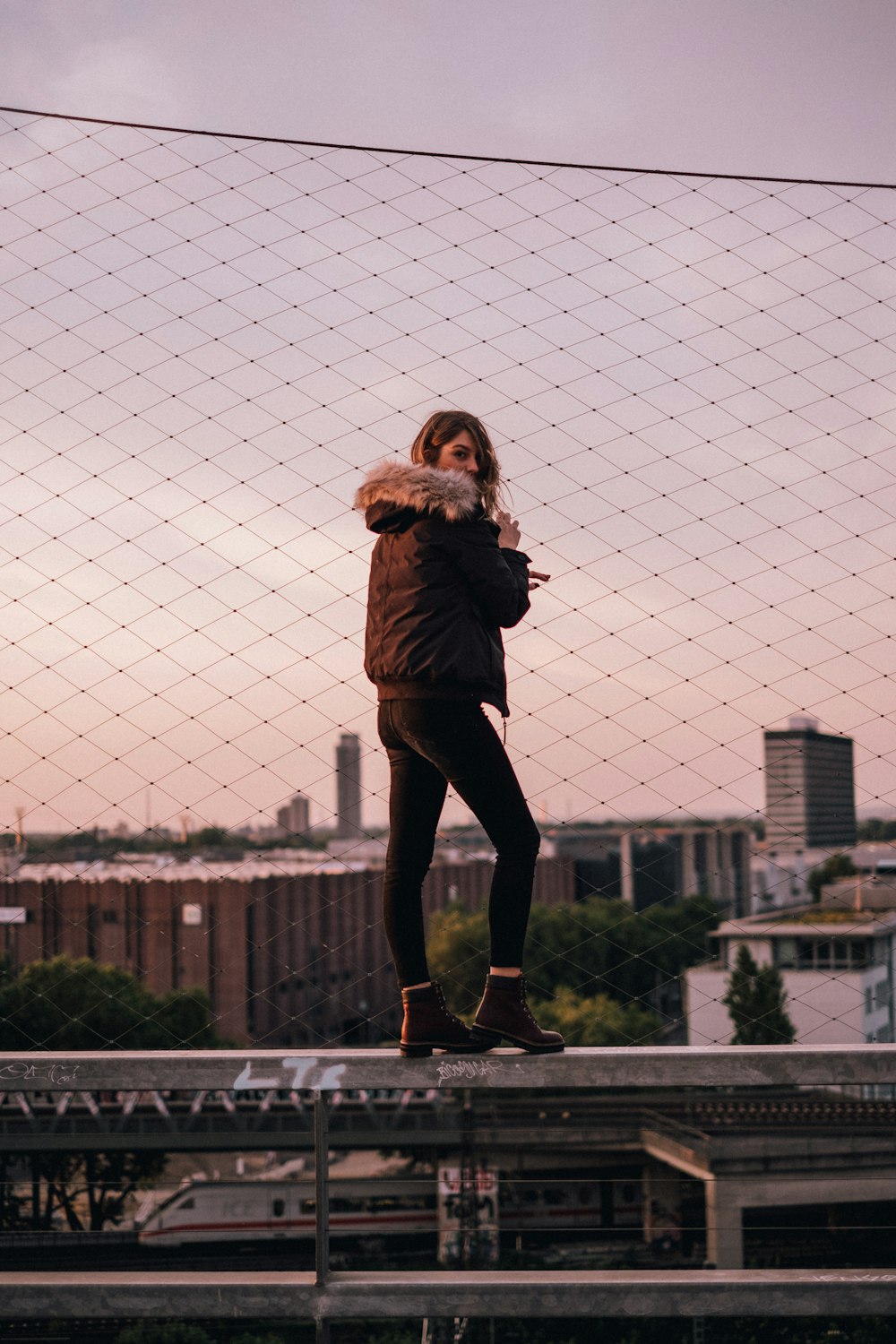 woman standing on railing