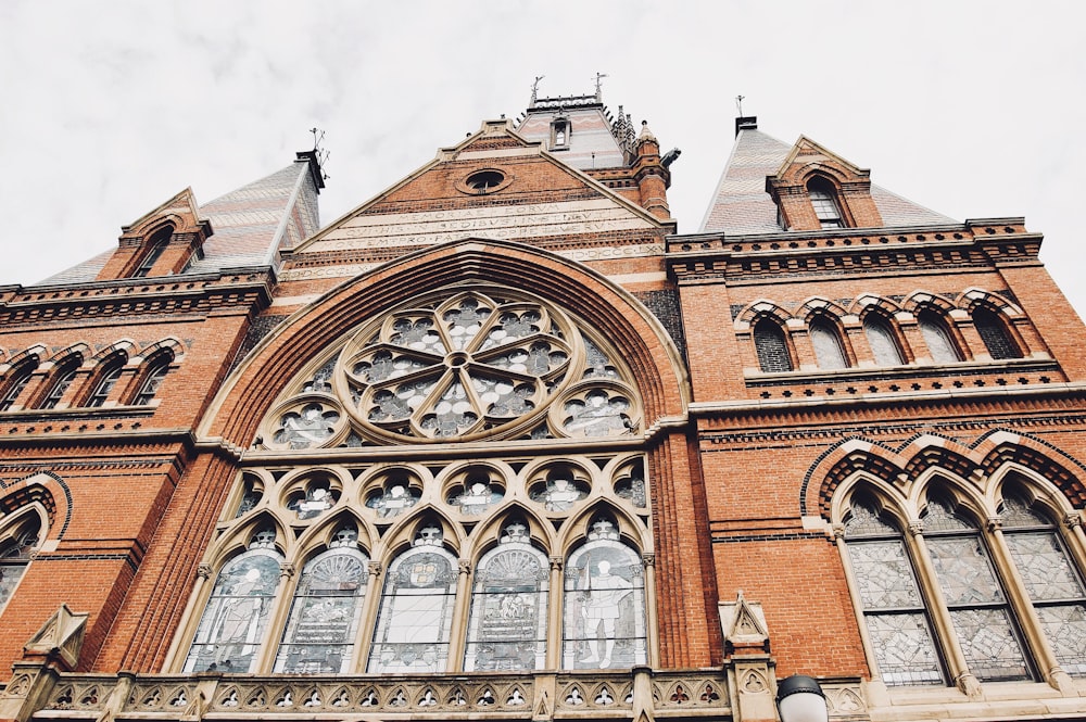 low angle photography of brown church