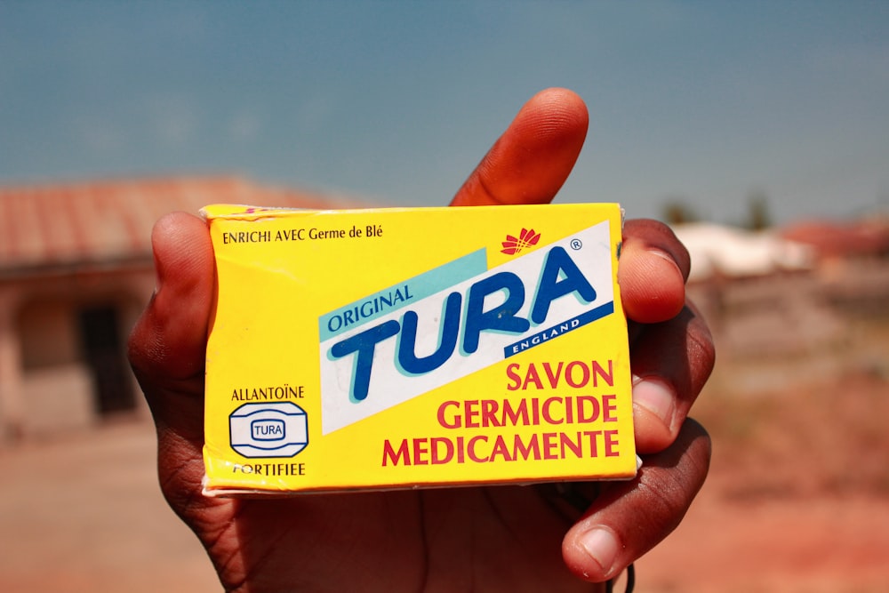 yellow and blue Tura savon germicide mdicamente box