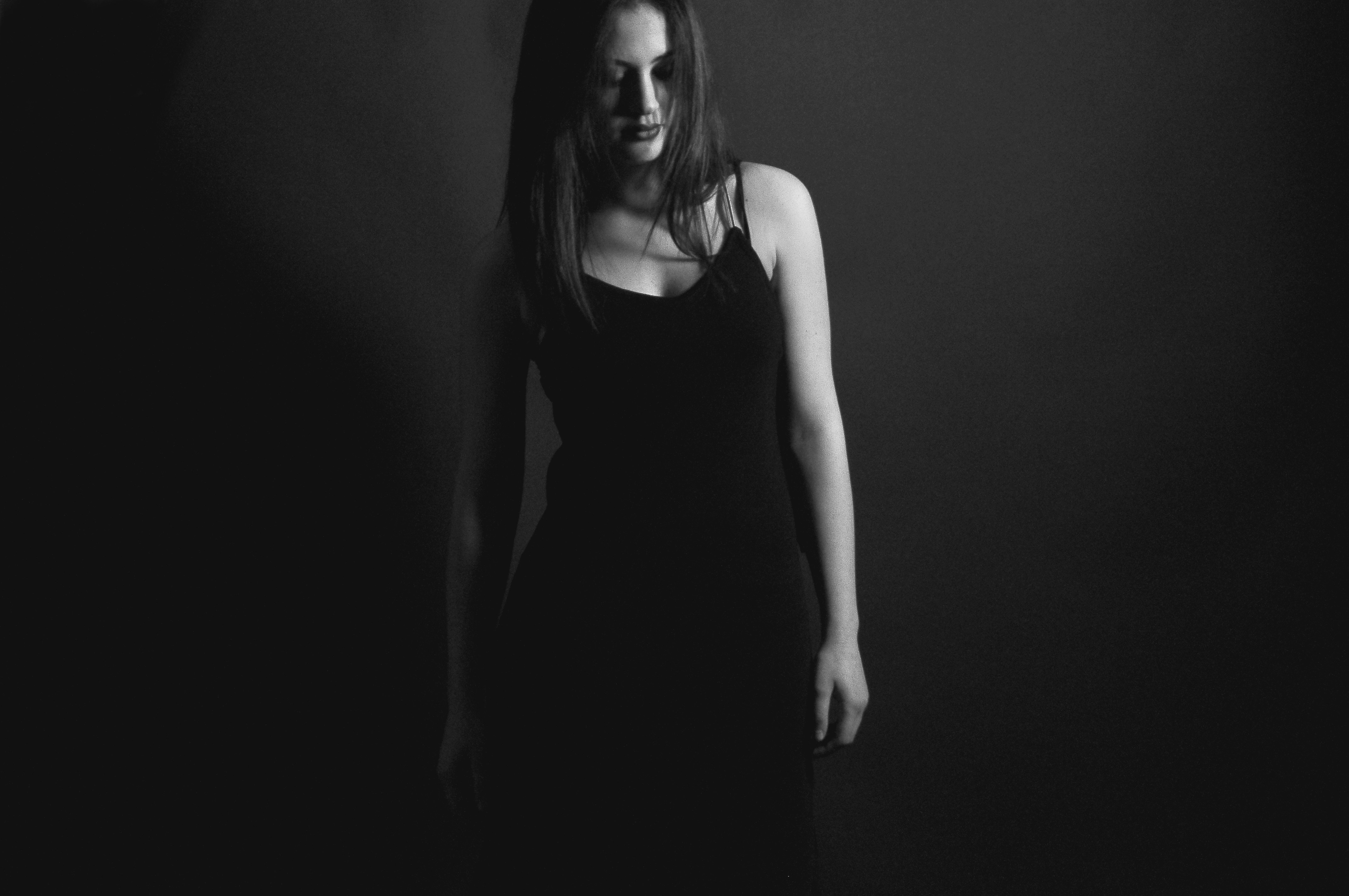 grayscale photography of woman in dress