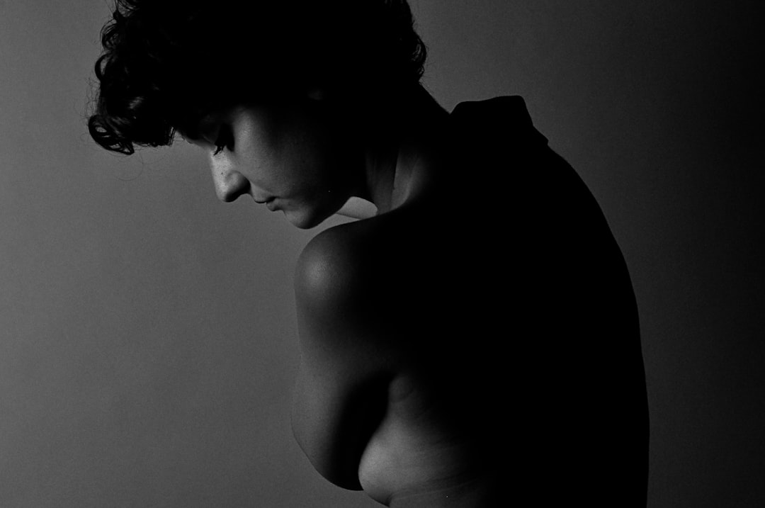 grayscale photo of topless woman