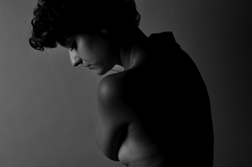 grayscale photo of topless woman