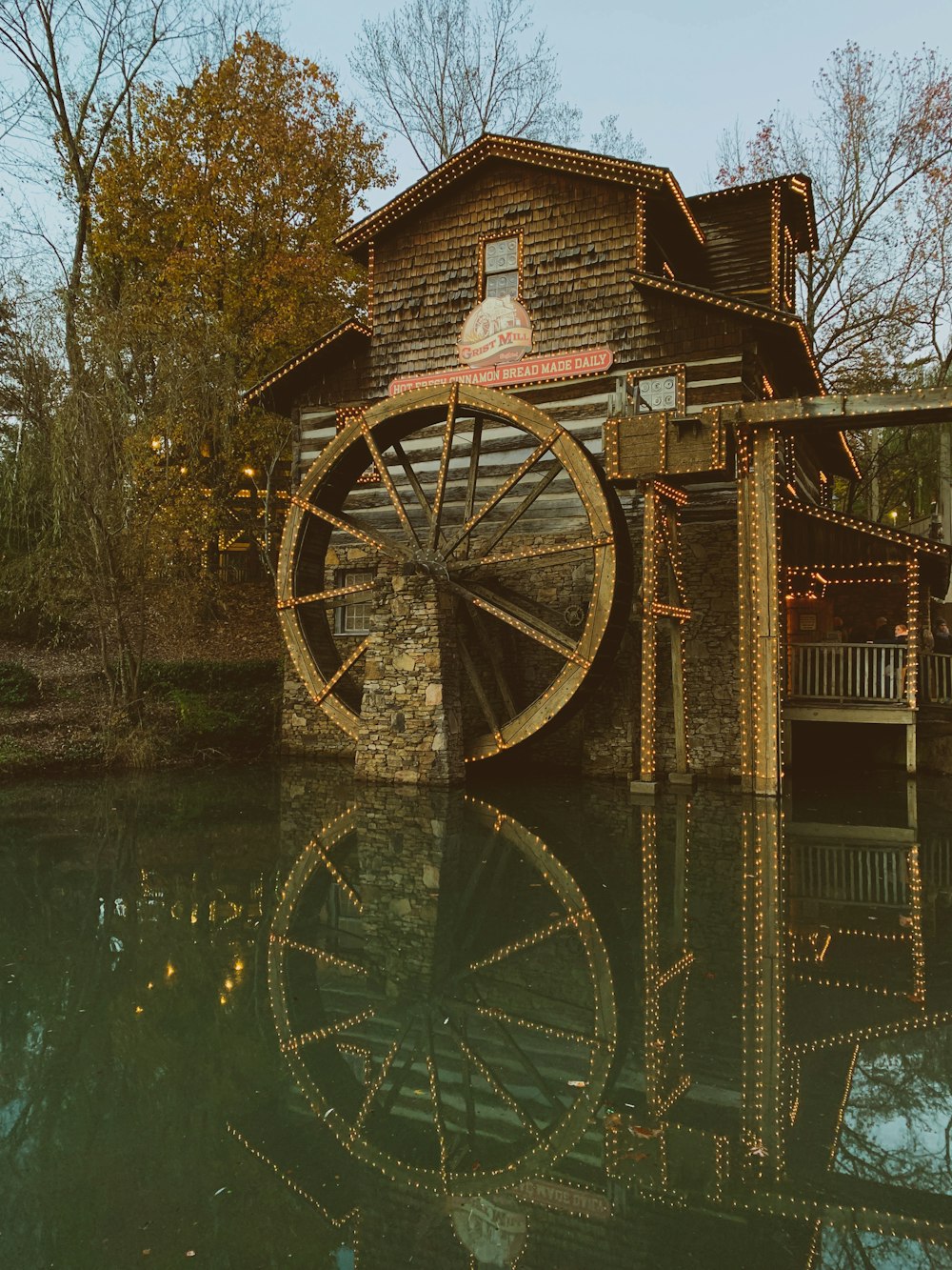 brown concrete house on body of water