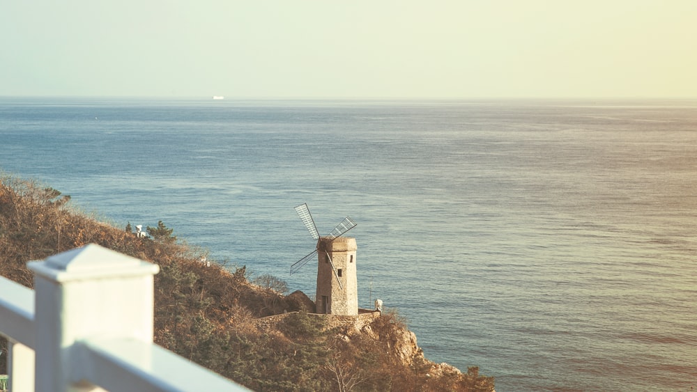 view of lighthouse near body of water