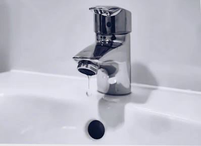 New stainless steel bathroom faucet installation by Dubai plumbing experts