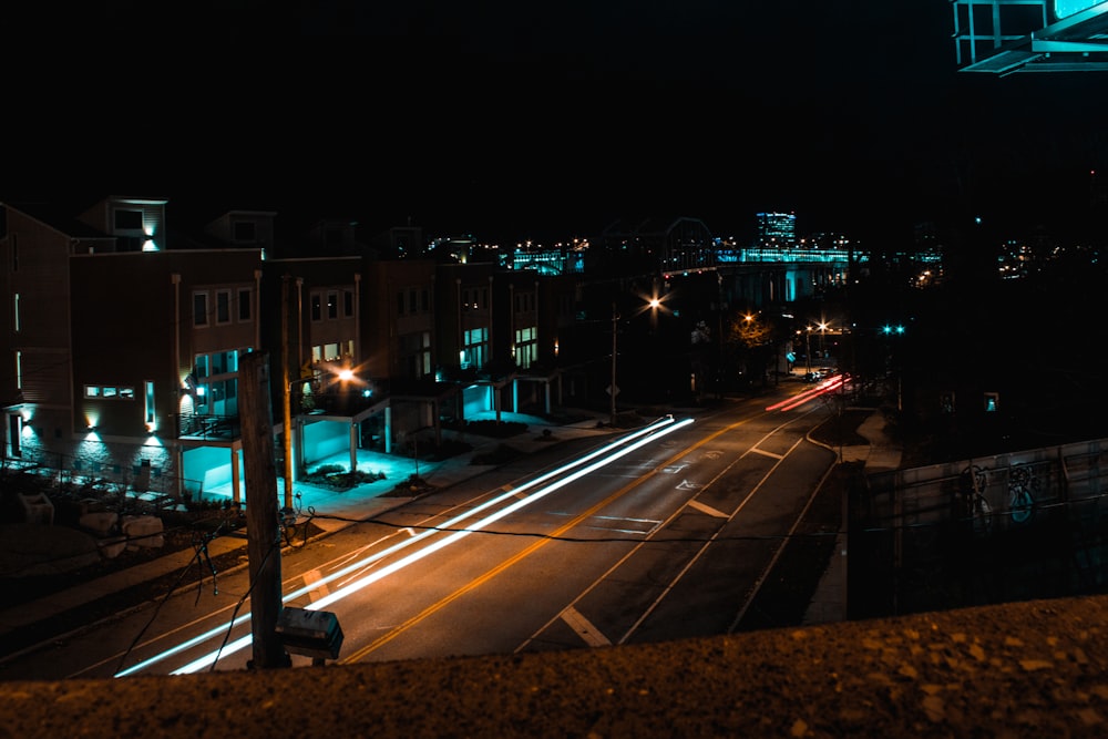 empty gray concrete road at nighttime