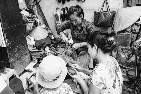 grayscale photography of three women standing