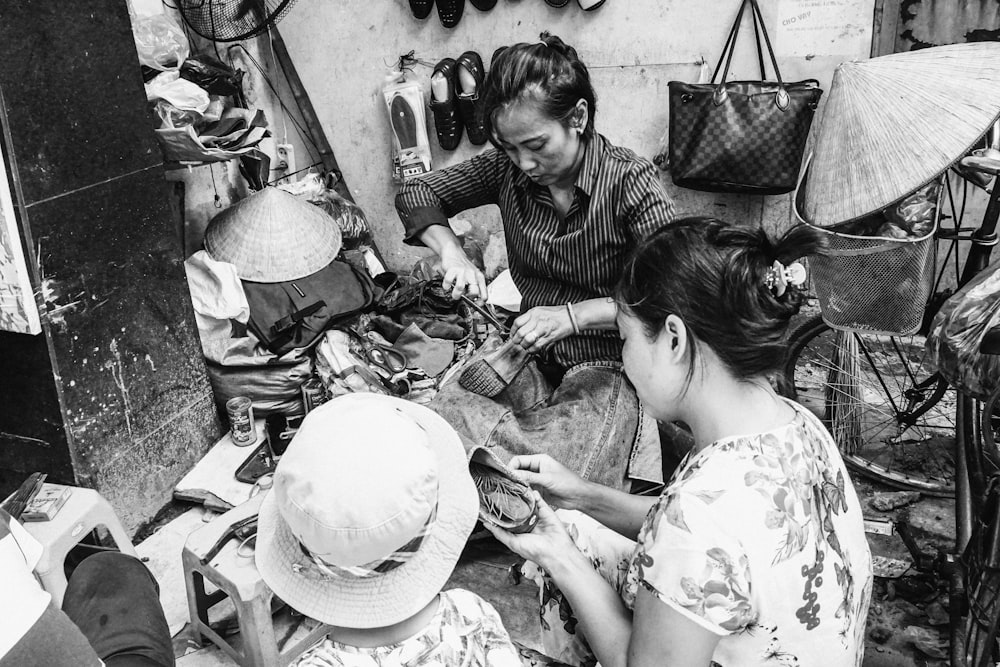 grayscale photography of three women standing