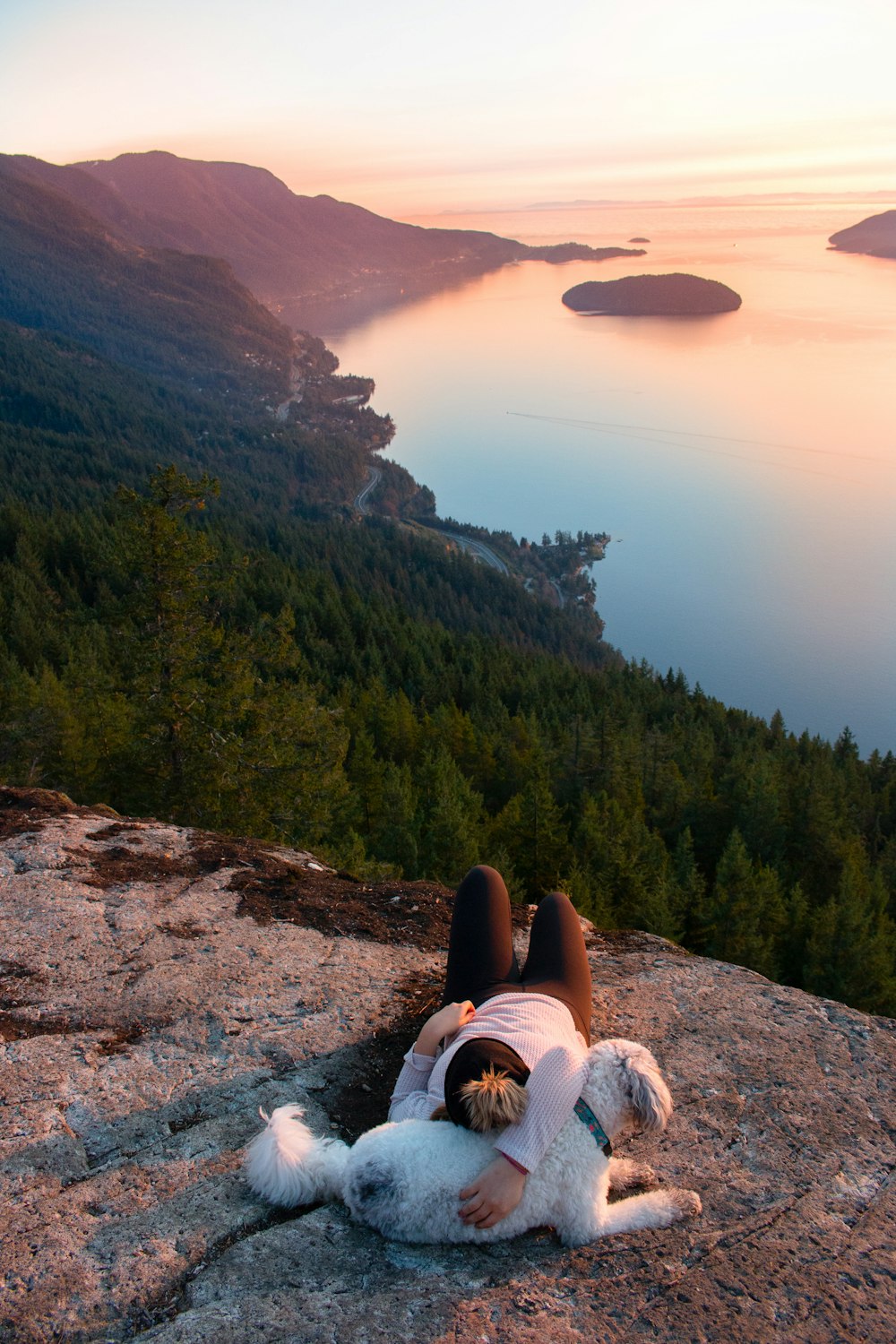 person lying on on rock