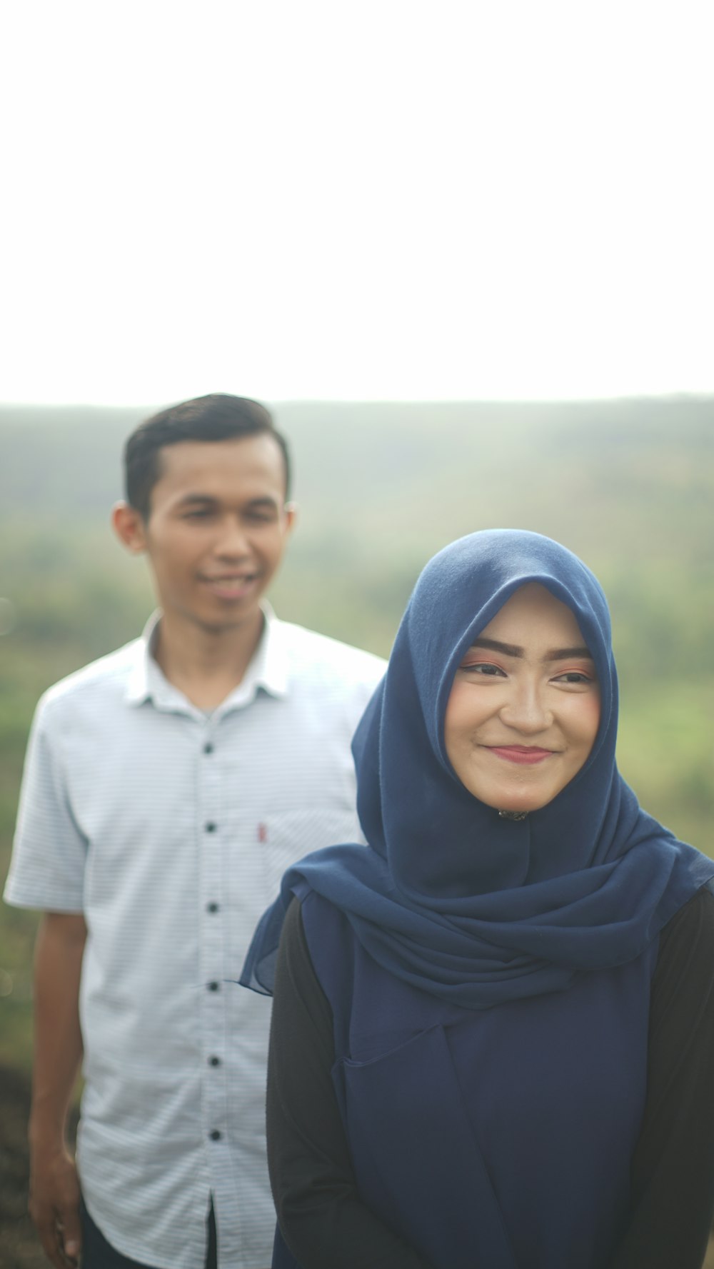 smiling woman beside man smiling