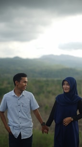 A happy couple connecting through the halal matchmaking platform, smiling warmly.