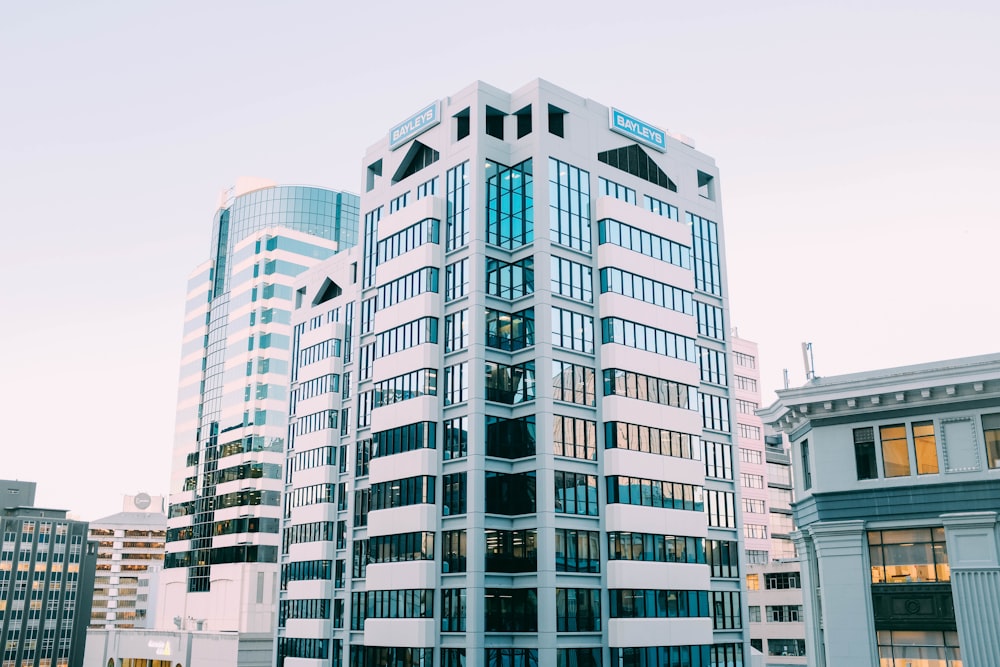 white concrete glass curtain building during daytime