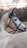 Close-up of a calm horse with a rider preparing for a trail ride in nature.