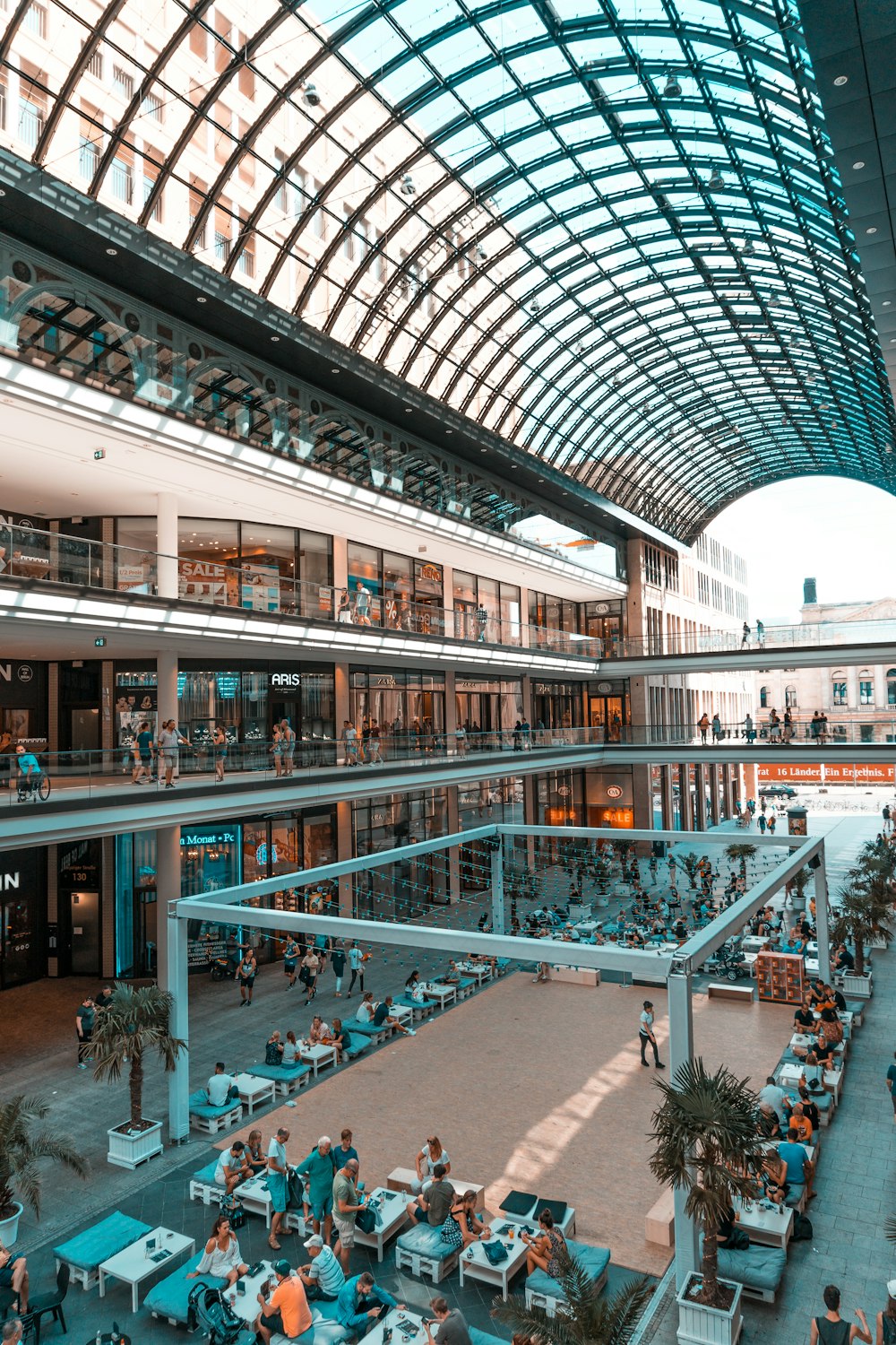 people inside grey metal building