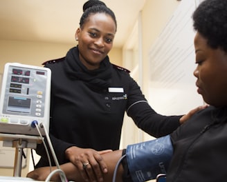 woman having blood pressure monitor