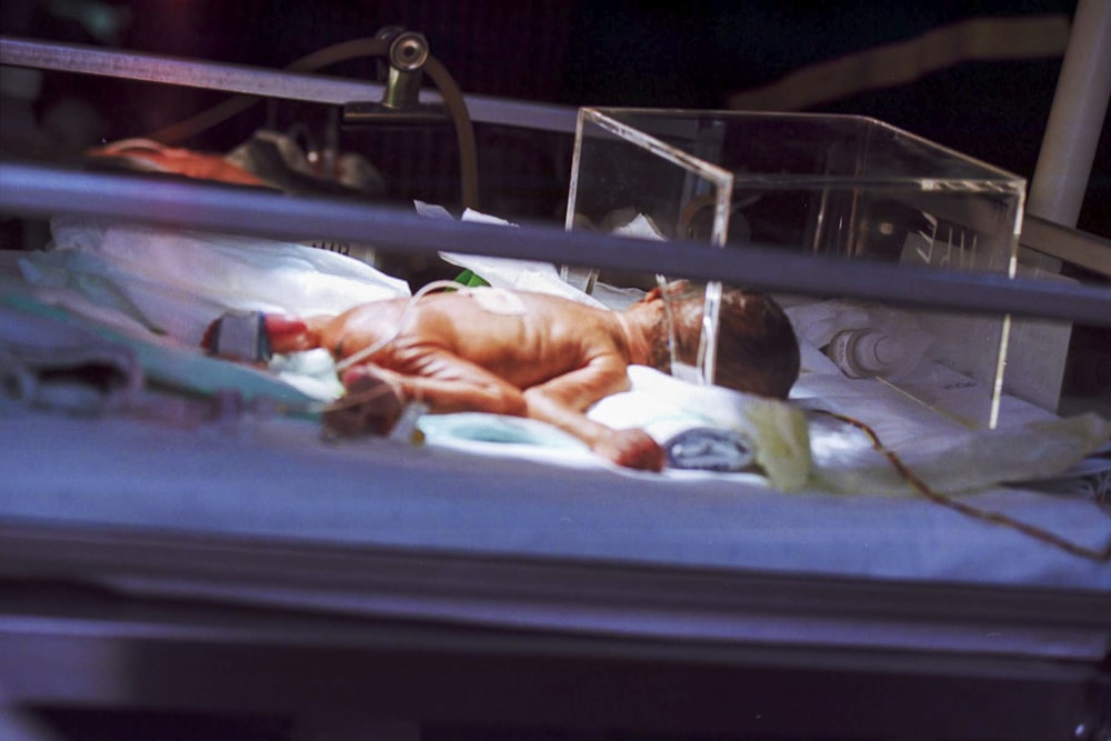 baby on incubator