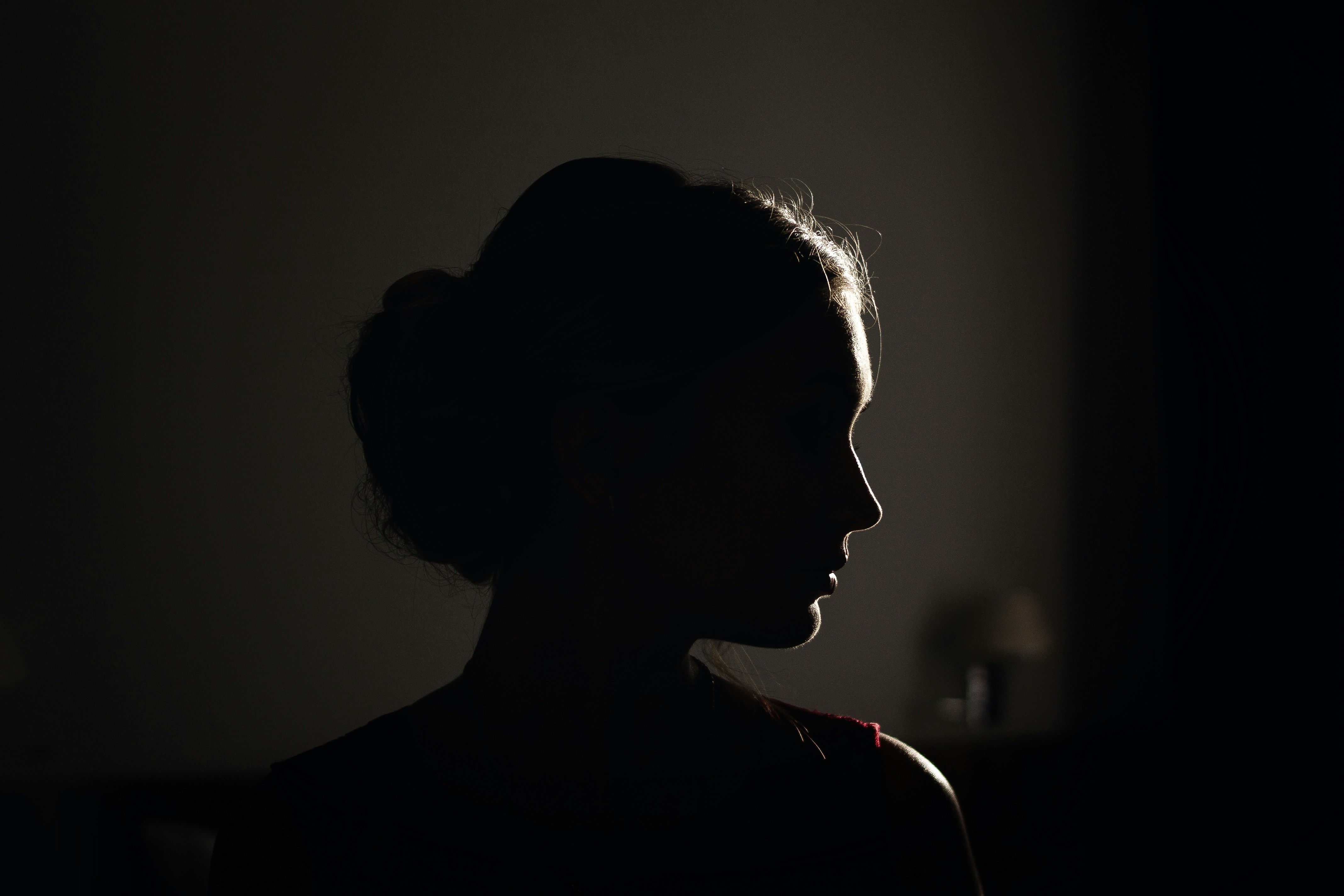Silhouette of woman speaking