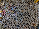 A close-up of various colorful fabric spools arranged neatly.