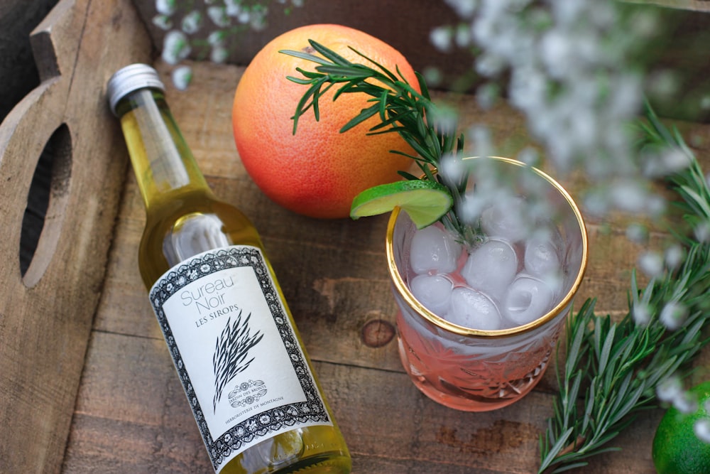 orange fruit and rock glass