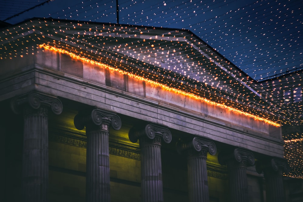 turned-on string lights in front of building