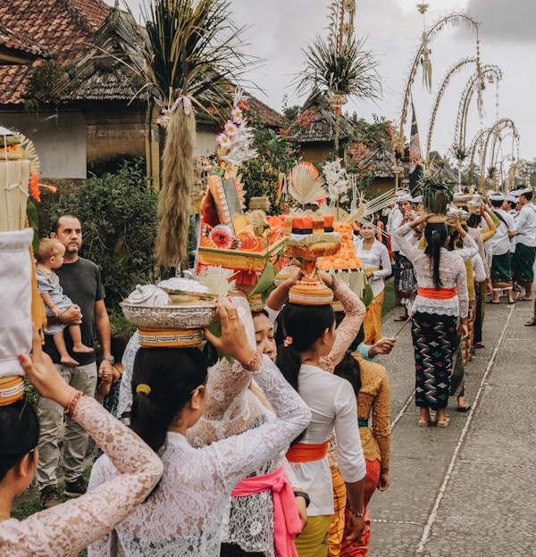 bali group of people parade on street