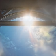 Soft sunlight filtering through a window illuminating a mystical altar.