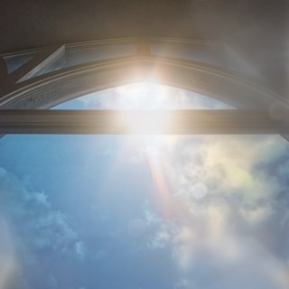 Soft sunlight filtering through a window illuminating a mystical altar.