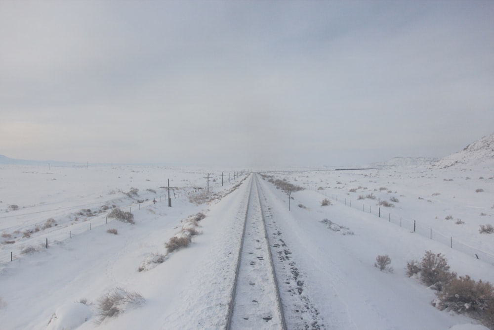 road covered with snow during daytime