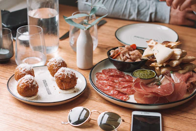 Close-up of rustic Italian appetizers artfully arranged on ceramic plates.