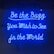 Bright blue neon letters against a dark background spell out an inspirational message in cursive font. The glow of the neon creates a striking contrast with the surroundings.