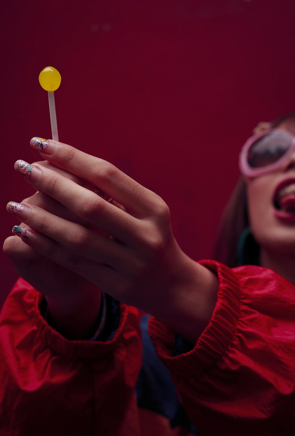 person holding lollipop